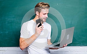 Advantage mobile internet. Handsome man use modern technologies. Digital concept. Online communications. School teacher