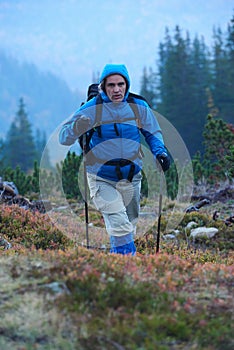 Advanture man with backpack hiking