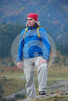 Advanture man with backpack hiking