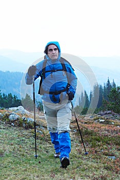 Advanture man with backpack hiking