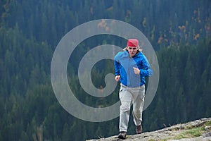 Advanture man with backpack hiking