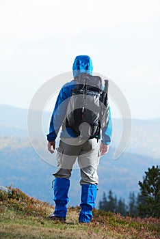 Advanture man with backpack hiking