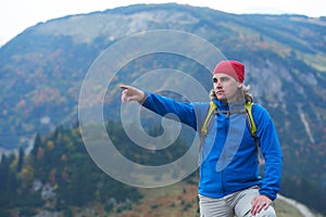 Advanture man with backpack hiking