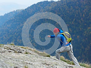 Advanture man with backpack hiking