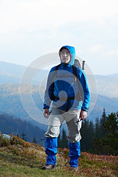Advanture man with backpack hiking