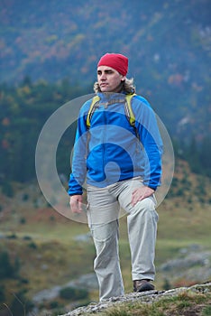 Advanture man with backpack hiking