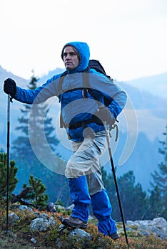 Advanture man with backpack hiking