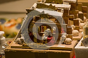 Advent Bazaar Stalls with glass, wooden, ceramic christmas souvenirs in shops. Close up of festive decorations for