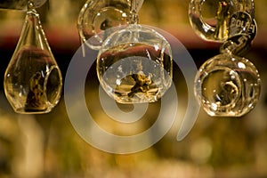 Advent Bazaar Stalls with glass, wooden, ceramic christmas souvenirs in shops. Close up of festive decorations for