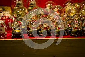 Advent Bazaar Stalls with glass, wooden, ceramic christmas souvenirs in shops. Close up of festive decorations for