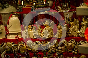 Advent Bazaar Stalls with glass, wooden, ceramic christmas souvenirs in shops. Close up of festive decorations for