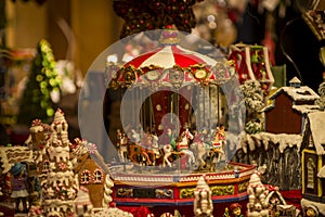 Advent Bazaar Stalls with glass, wooden, ceramic christmas souvenirs in shops. Close up of festive decorations for