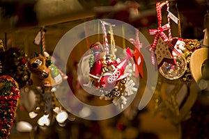 Advent Bazaar Stalls with glass, wooden, ceramic christmas souvenirs in shops. Close up of festive decorations for