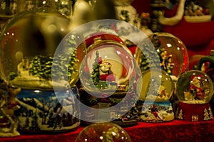 Advent Bazaar Stalls with glass, wooden, ceramic christmas souvenirs in shops. Close up of festive decorations for