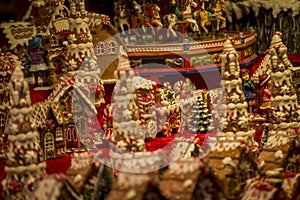 Advent Bazaar Stalls with glass, wooden, ceramic christmas souvenirs in shops. Close up of festive decorations for