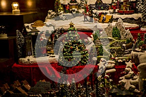 Advent Bazaar Stalls with glass, wooden, ceramic christmas souvenirs in shops. Close up of festive decorations for