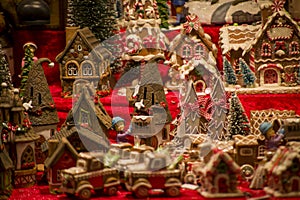 Advent Bazaar Stalls with glass, wooden, ceramic christmas souvenirs in shops. Close up of festive decorations for