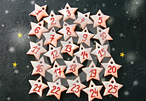 Advent calendar from gingerbread star cookies. Numbers from 1 to