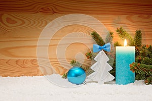 Advent candle and wood fir tree . Christmas background.