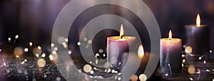 Advent Candles - Four Purple Votive Candlelight In Church