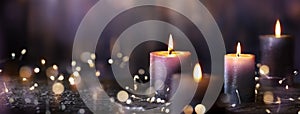 Advent Candles - Four Purple Votive Candlelight In Church photo