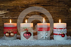 Advent decoration with four burning candles