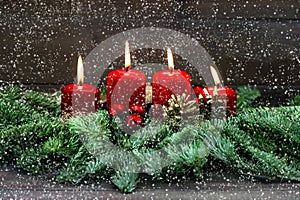 Advent decoration. Four red burning candles. Holidays background