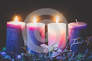 Advent decoration with three burning candles