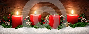 Advent decoration with three burning candles