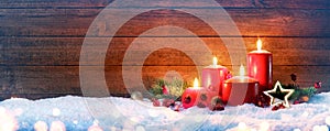 Advent Season - Four Red Candles On Snow