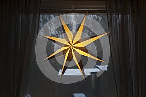 Advent star christmas decorations with snow outside