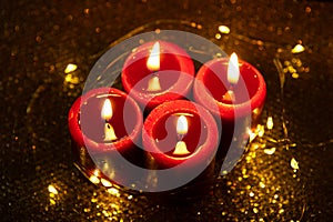 Advent theme with 4 burning red candles and Christmas lights.