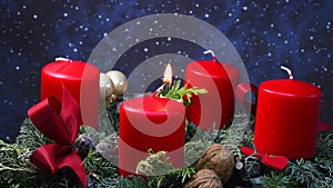 Advent wreath, igniting first candle