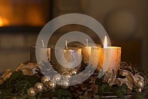 Advent wreath with one burning candle