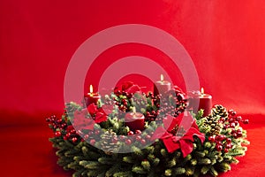 Advent wreath over red background