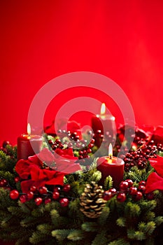 Advent wreath over red background