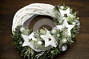 Advent wreath with white stars. Christmas lights