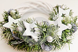 Advent wreath with white stars. Christmas lights