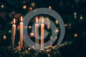 advent wreaths with 4 burning candles