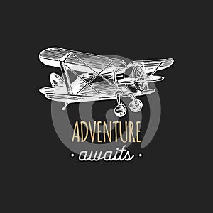 Adventure awaits motivational quote. Vintage retro airplane logo.Hand sketched aviation illustration in engraving style.