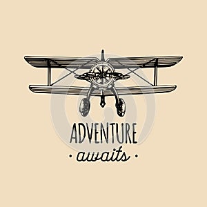 Adventure awaits motivational quote. Vintage retro airplane logo.Hand sketched aviation illustration in engraving style.