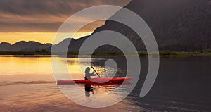 Adventure Caucasian Adult Woman Kayaking in Red Kayak