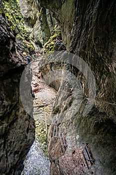 Adventure hiking trail through canyon in Slovak paradise national park, Slovakia.  Via ferrata in canyon Kysel. Discovery travel c