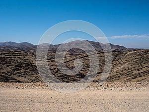 Adventure journey scene on dirt road trip through layers of great rock mountain texture panorama landscape view background