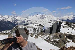 Adventure man hiking wilderness mountain with backpack, outdoor lifestyle survival vacation. Whistler vacation