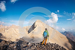 Adventure in the mountains. climber with a backpack in the mountains. Tourist traveling to the mountains. mountaineering and rock
