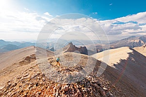 Adventure in the mountains. climber with a backpack in the mountains. Tourist traveling to the mountains. mountaineering and rock