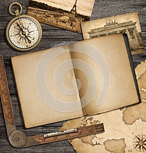 Adventure nautical background with vintage copybook and compass