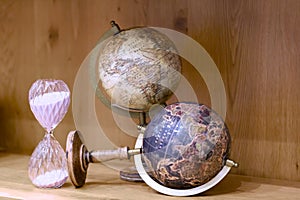 Adventure stories background. Old globe on map background.