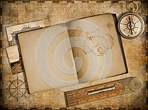 Adventure and travel concept. Vintage map, copybook and compass. photo